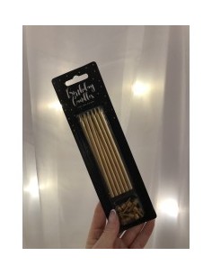 Longues bougies dorées